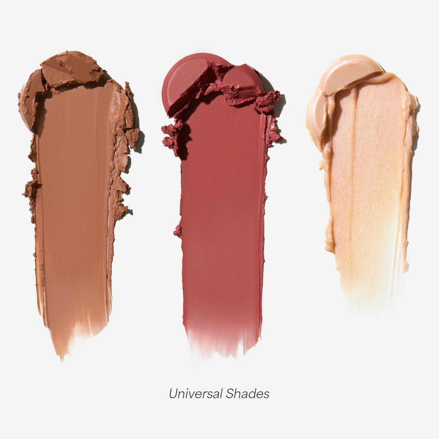 Three cylindrical makeup stick containers with different shades.