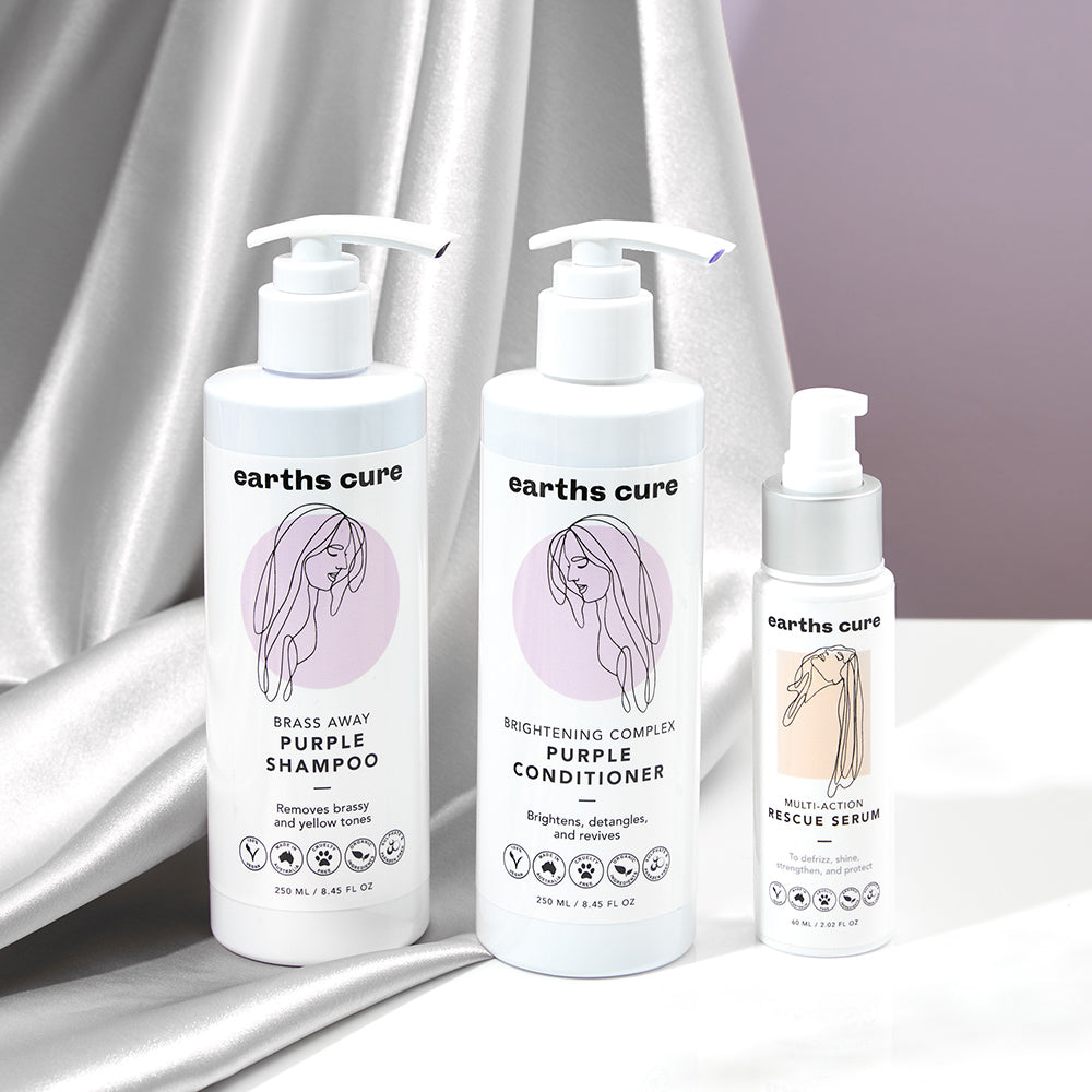 Silver Hair Products: Purple Shampoo, Purple Conditioner, Serum resting on table
